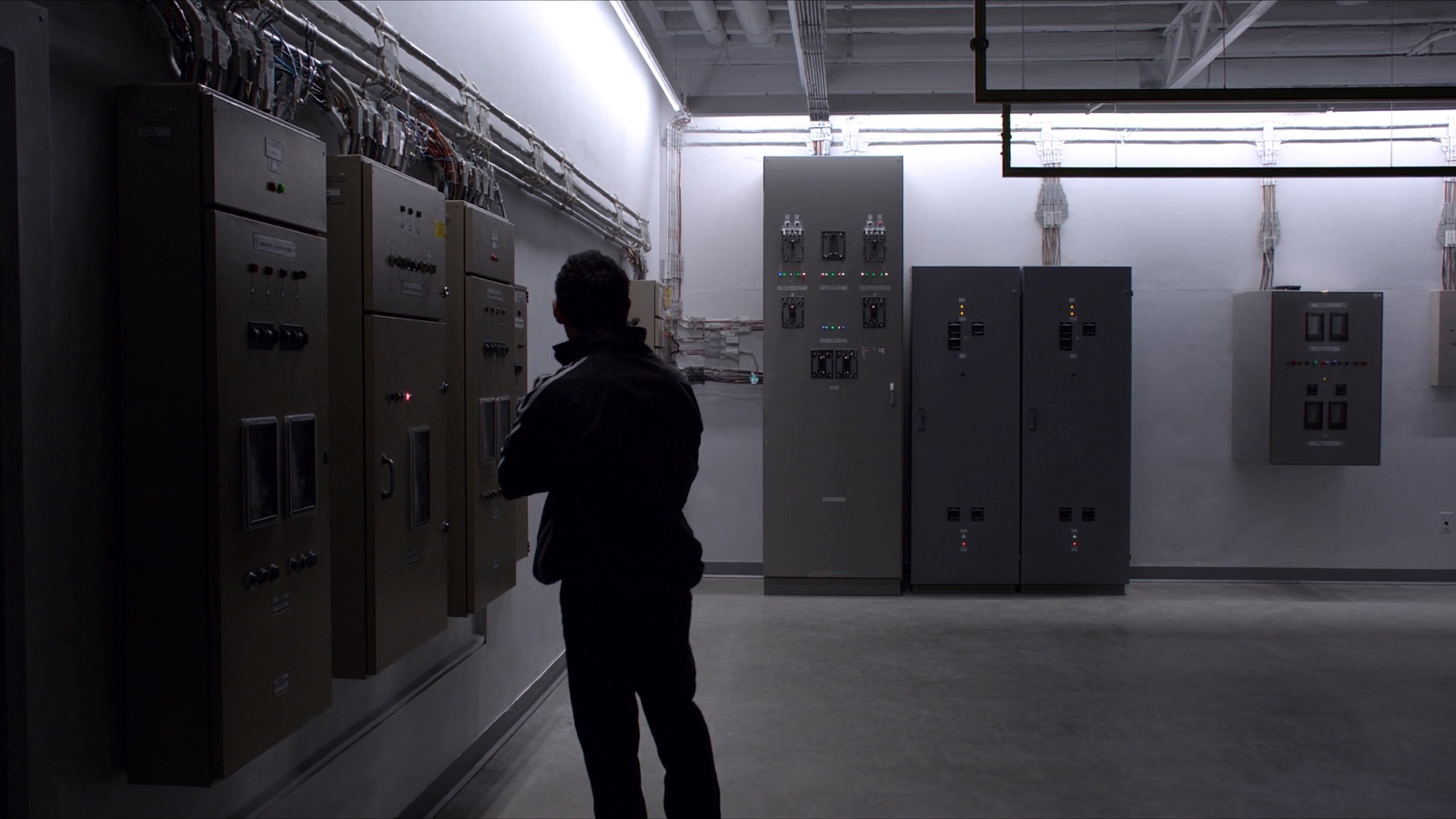 Commercial electrical room with three-phase distribution panels and organized conduit runs